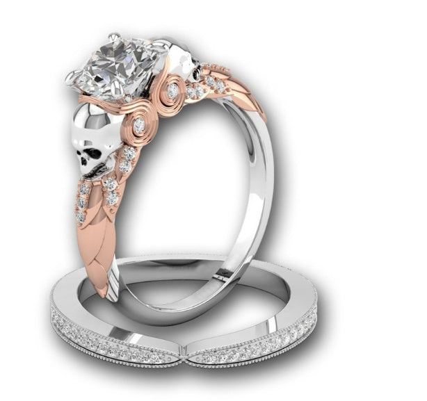 Two-tone diamond ring with skulls